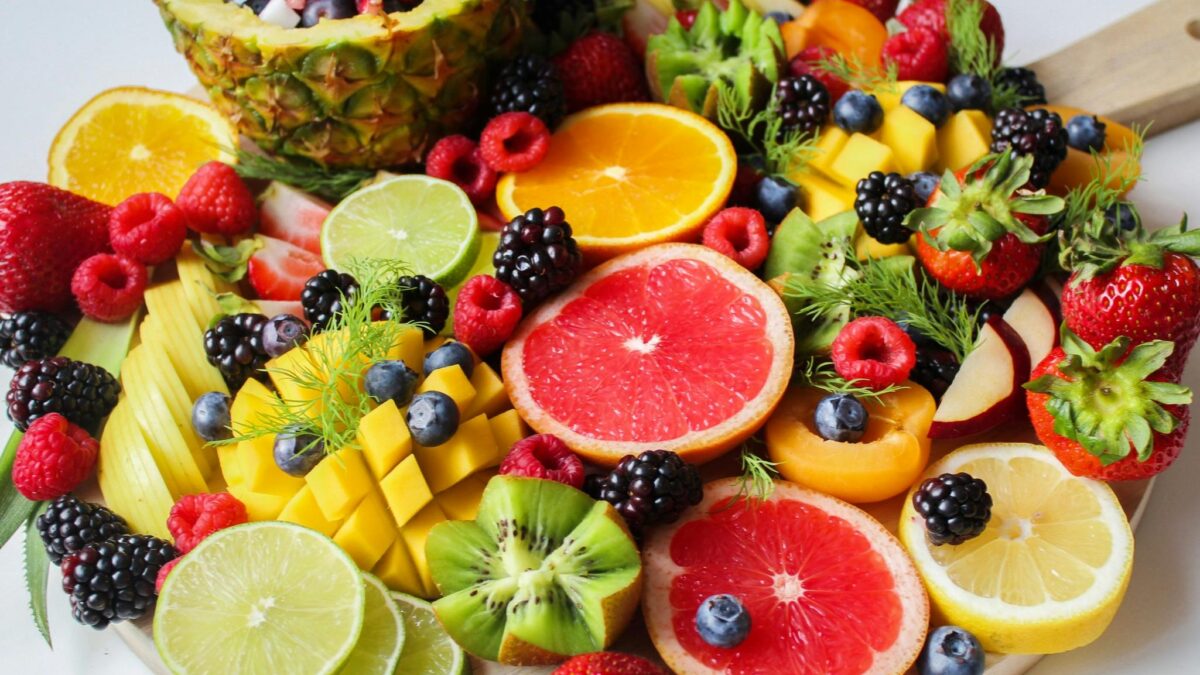 A vibrant assortment of fresh fruits beautifully arranged on a platter, perfect for a healthy and delicious snack.